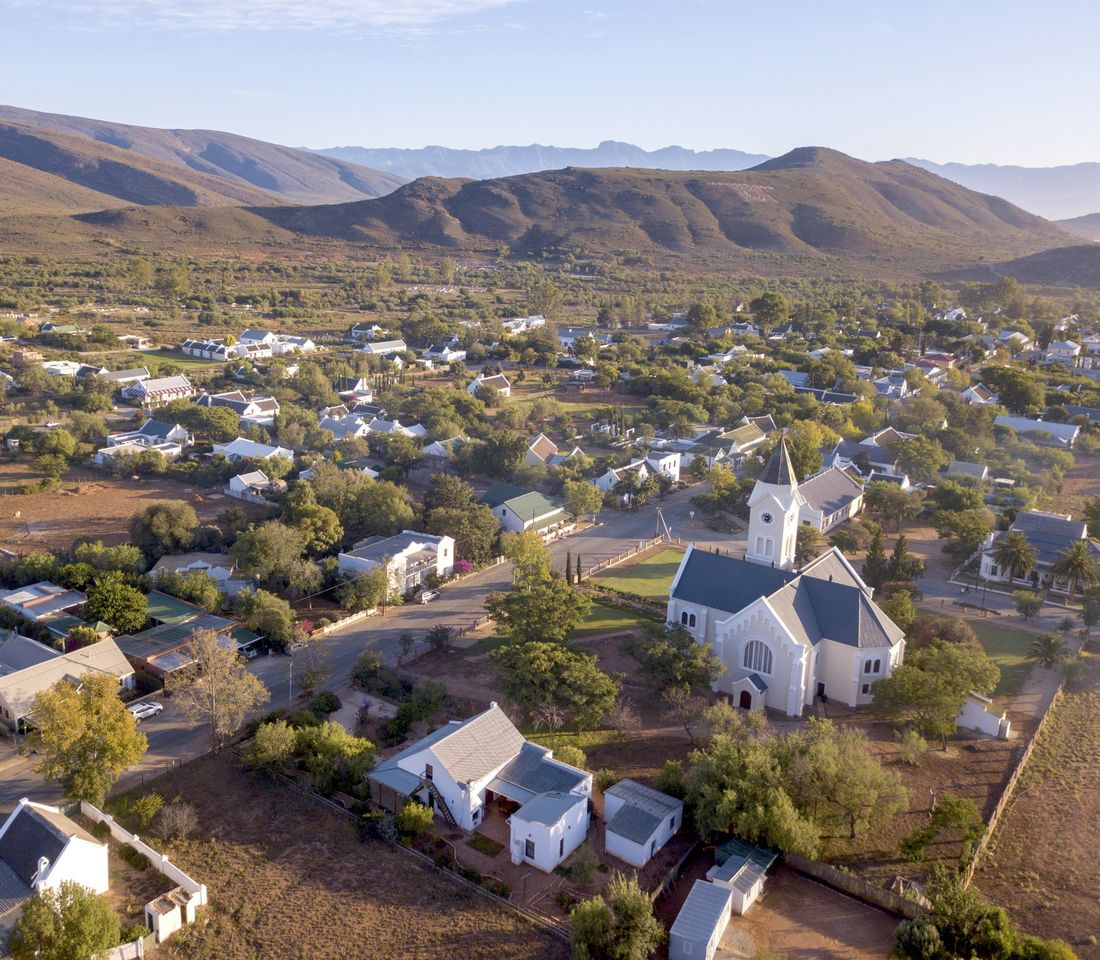 Aerial view of a small town between mountains